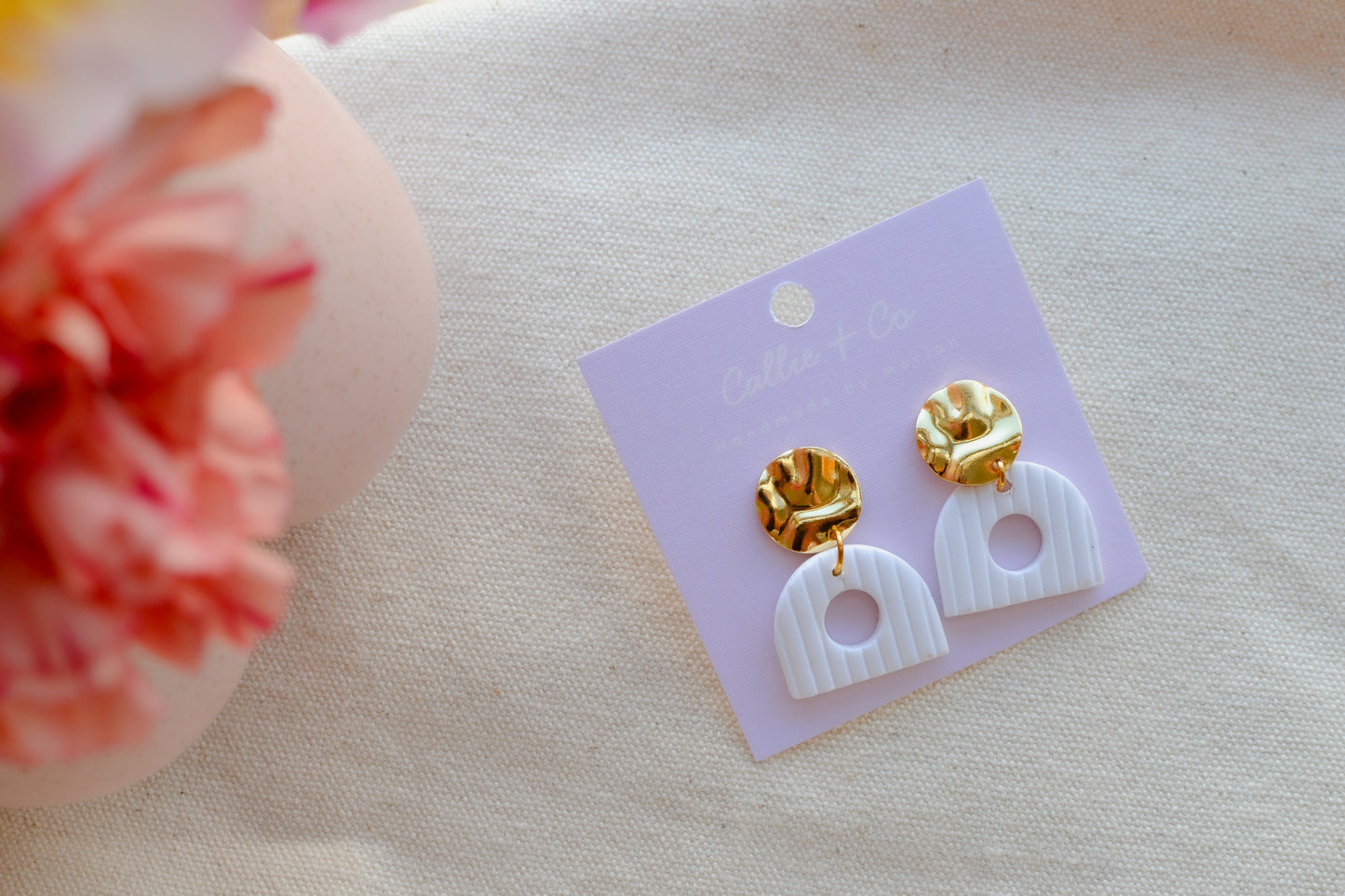 the nia | gold and white