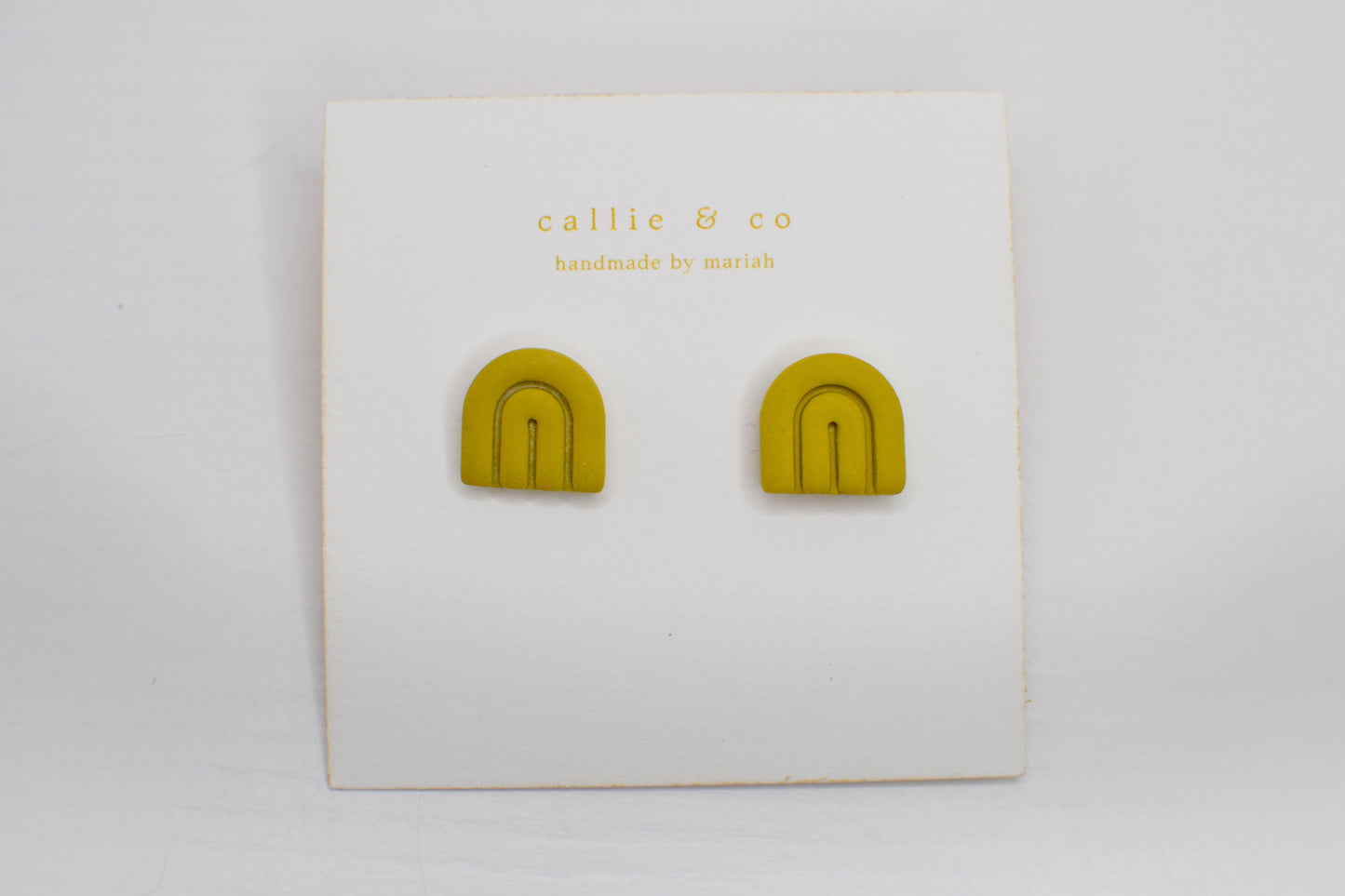 modern minimalist studs | bright green arches